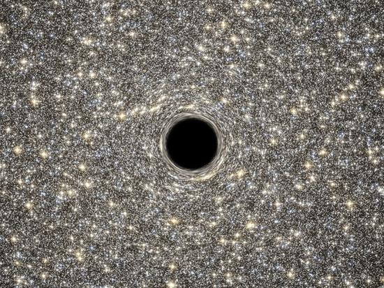 艺术示意图：星系M60-UCD1中的黑洞。传统观点认为随着黑洞消失，它所吞噬的物质所包含的信息也将从宇宙中消失。但这与量子力学原理相矛盾，从而产生所谓“黑洞信息悖论”